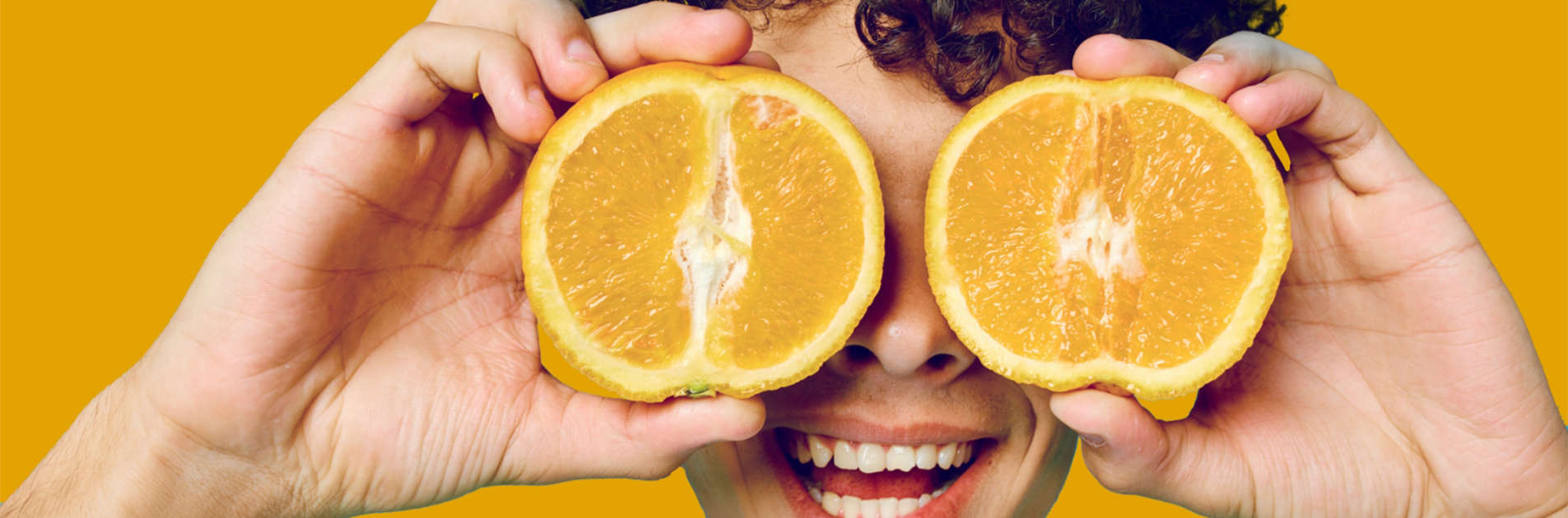 The importance of Immune Health - Bioteen Health Blog - Teen holding orangesin front of eyes
